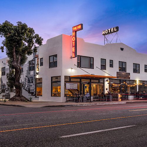 A white building with a neon-lit 